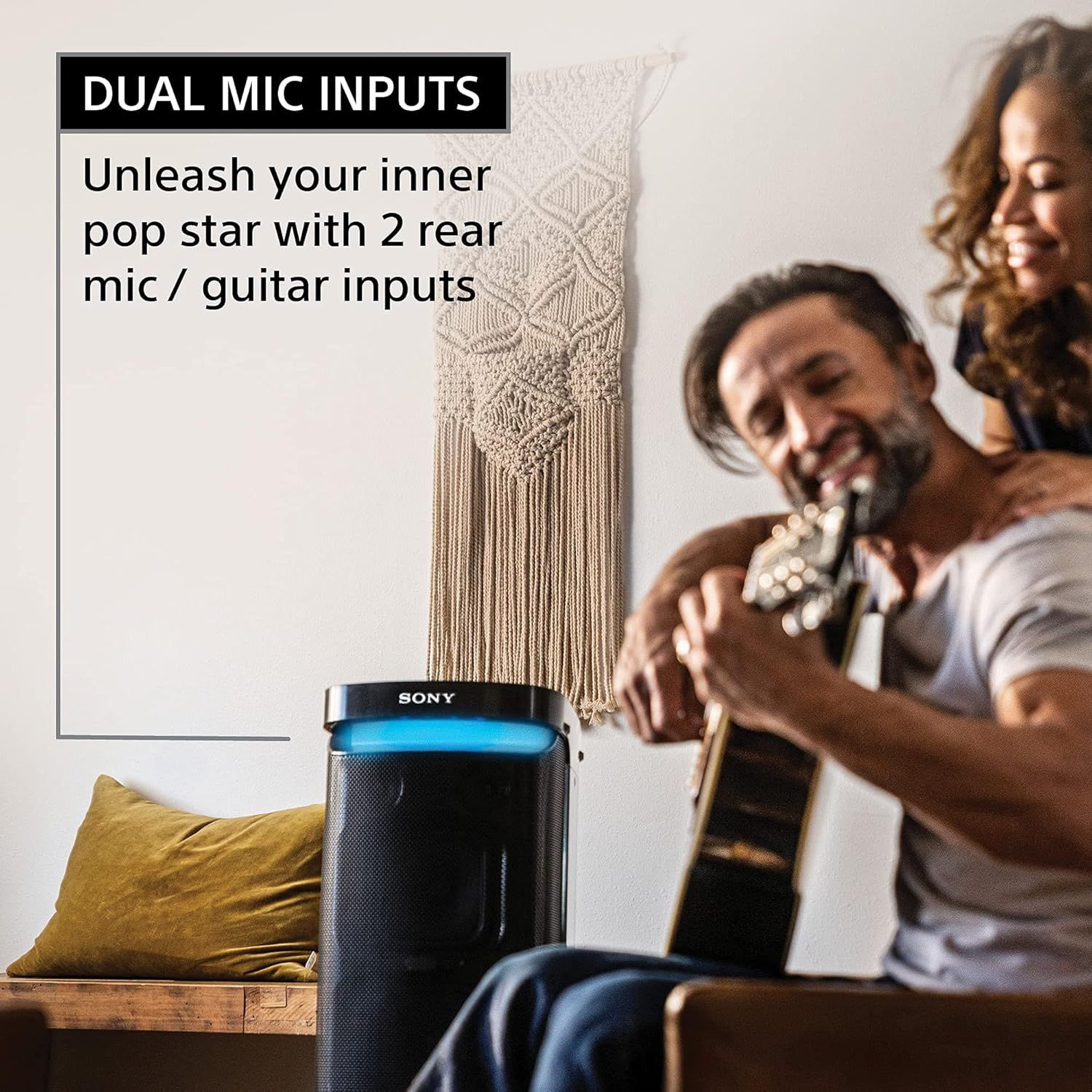 Communicates that the speaker has dual microphone and guitar inputs, enabling users to perform karaoke or play music with multiple inputs simultaneously.