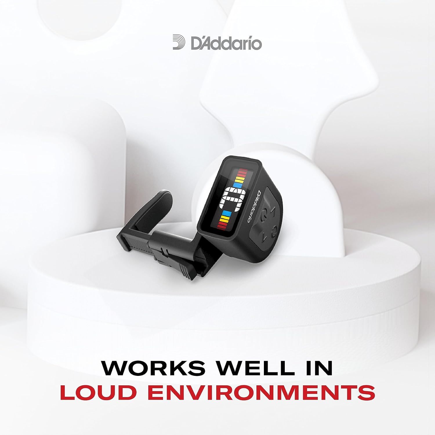 Communicates that the D'Addario tuner is effective in noisy settings, reassuring musicians that it will perform reliably during loud rehearsals or performances.