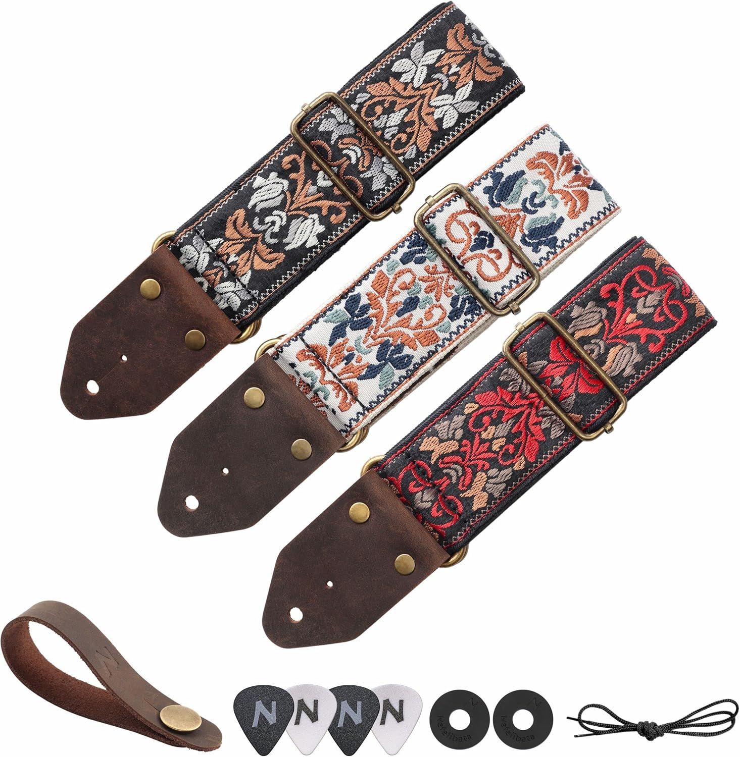 Shows everything included with the purchase: three decorative guitar straps with leather ends, a leather strap holder, guitar picks, strap locks, and a string winder to demonstrate the complete…