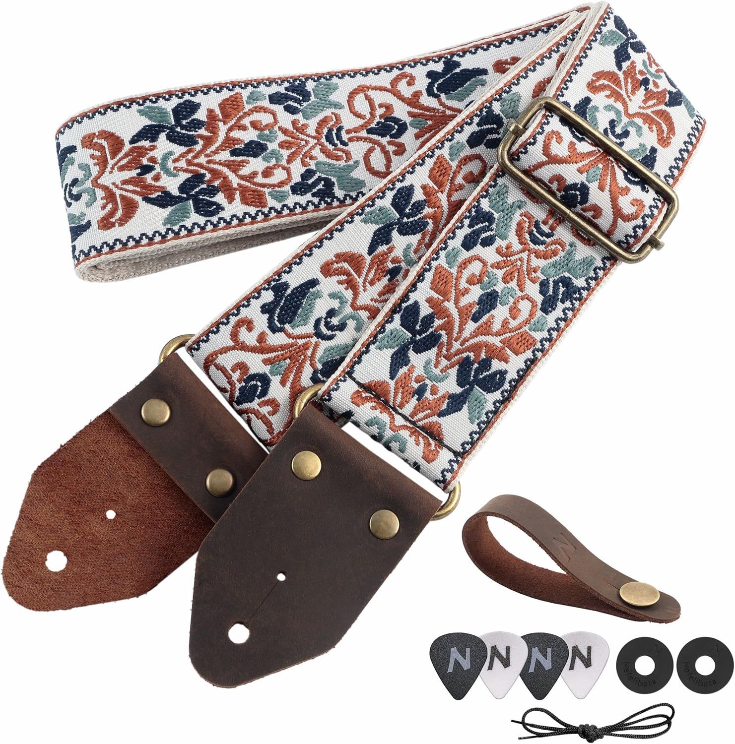 Shows everything included in the purchase: decorative guitar strap with leather ends, adjustable buckle, strap holder, guitar picks, strap locks, and laces to reassure buyers of the complete package…