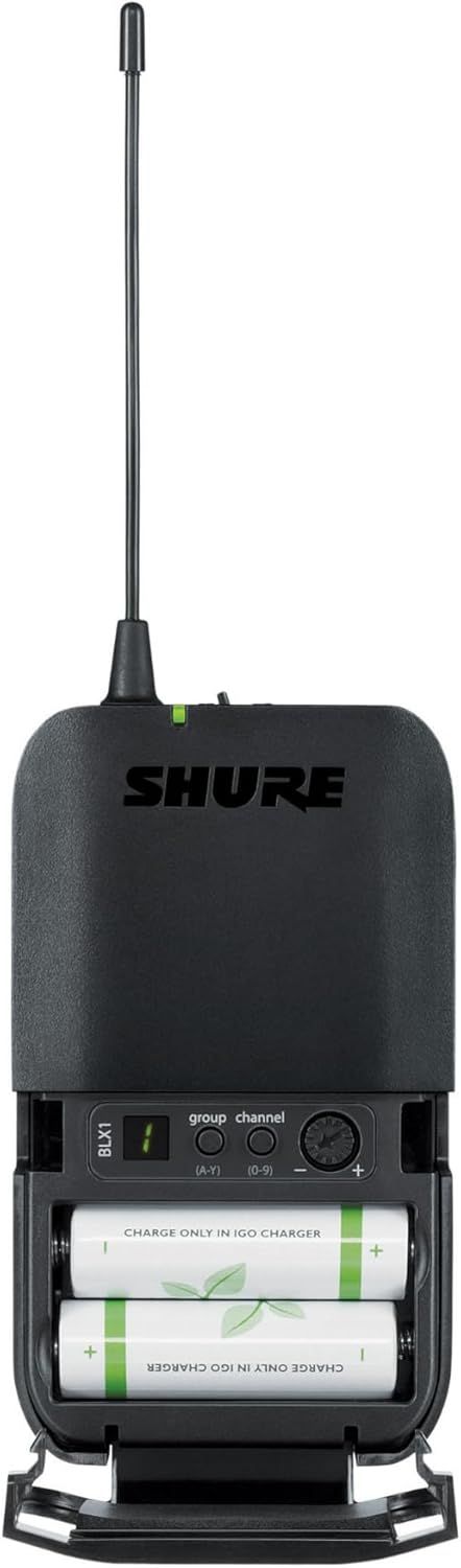 Shows the internal battery compartment and control interface of the wireless receiver to help users understand how to load batteries and operate the device.