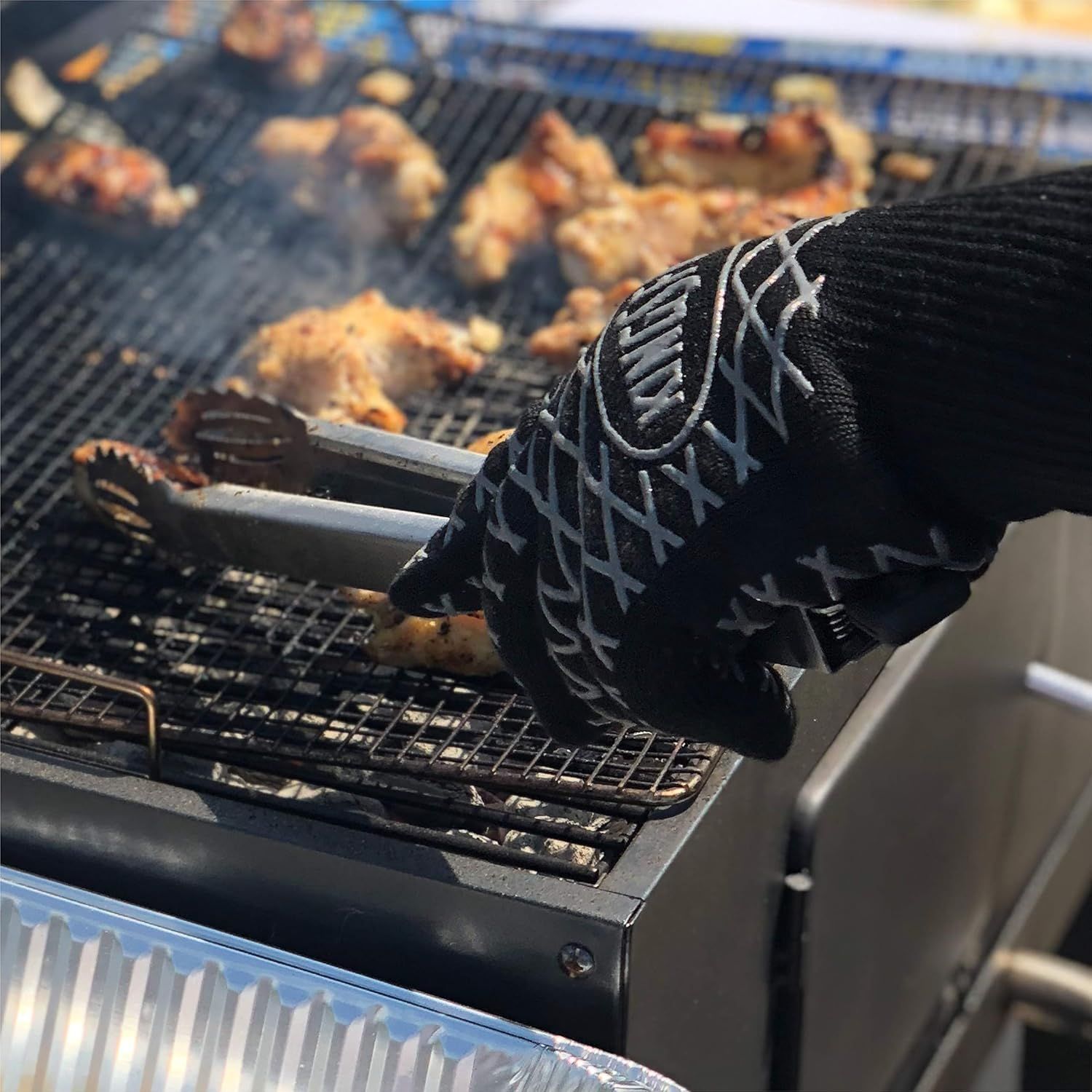 Demonstrates the product's heat-resistant capability by showing it safely handling hot grilling tools over an active grill, reassuring shoppers it provides protection during high-heat cooking.