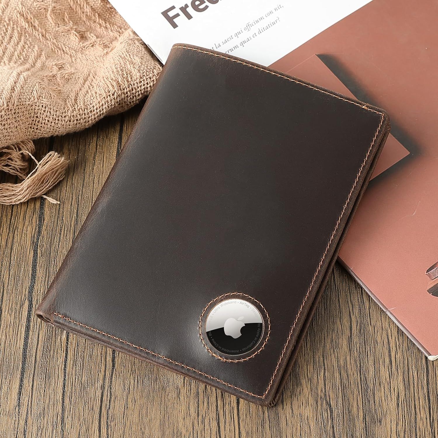 Demonstrates that the wallet includes a built-in slot for an Apple AirTag, allowing customers to track their wallet if lost.