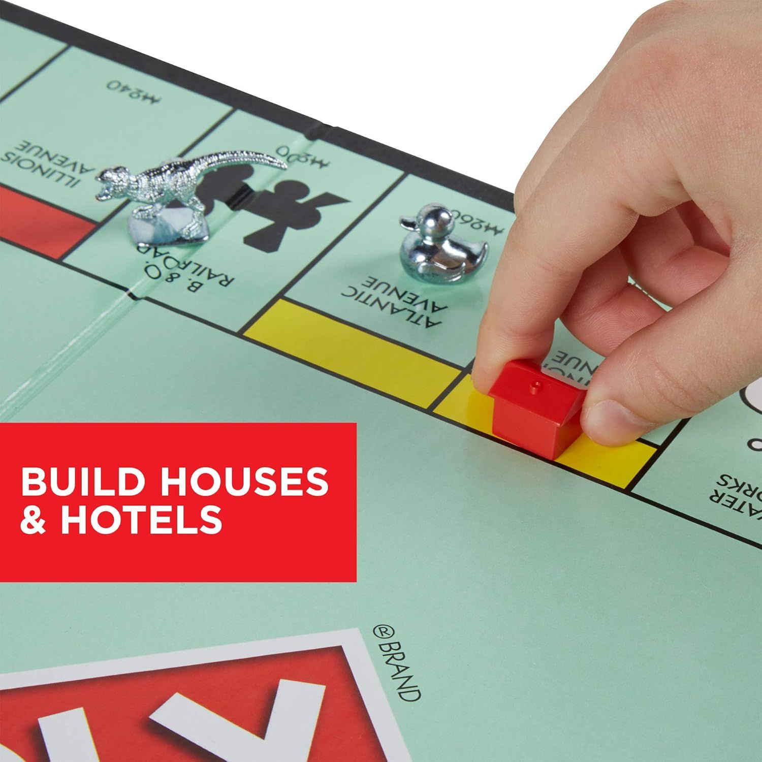 Demonstrates how to play the game by showing the action of building houses and hotels on properties, helping shoppers understand the core gameplay mechanic. Highlights the key gameplay feature of…