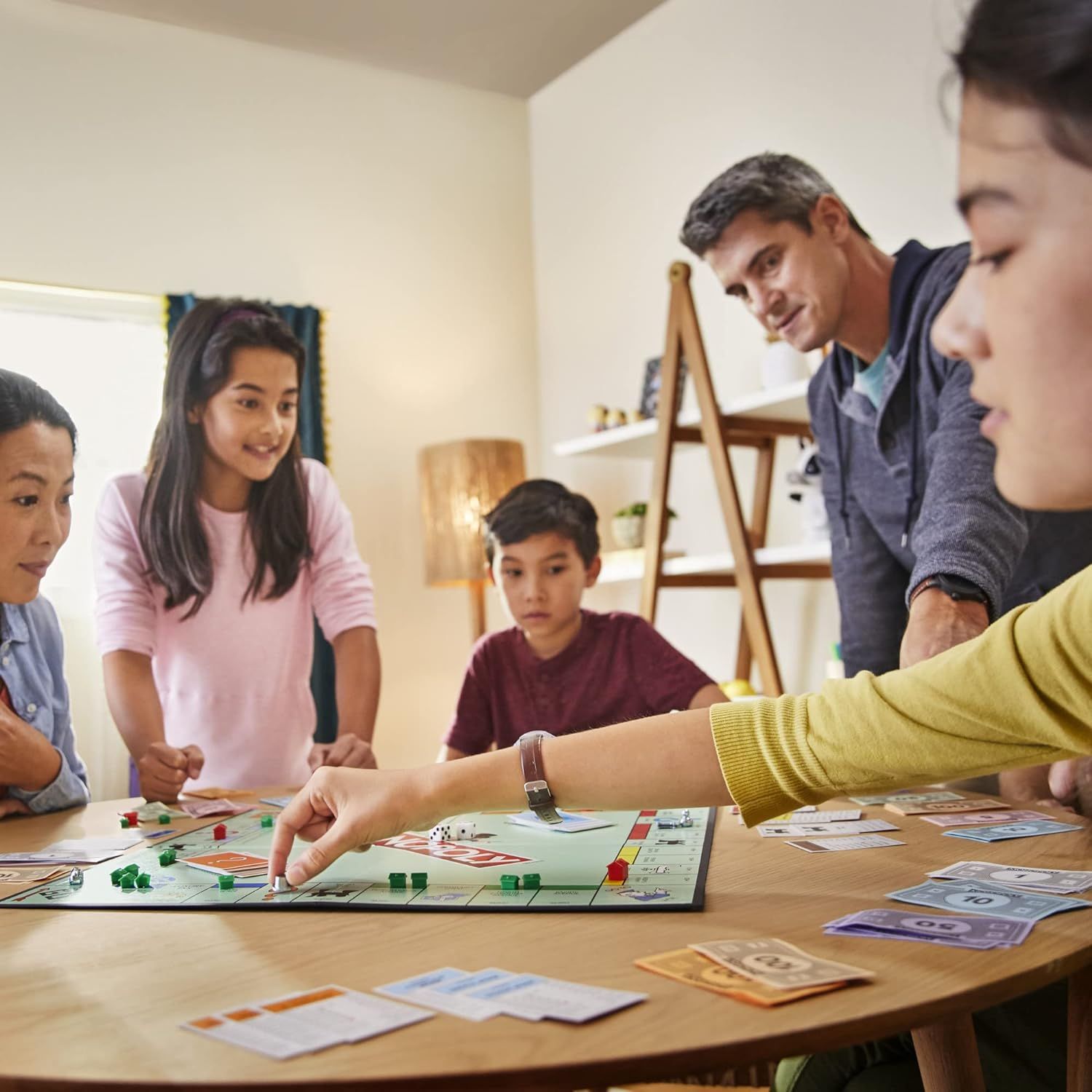 Shows the product being enjoyed in a real-world family setting to help shoppers visualize the product in their own homes and emphasize its role in bringing people together.