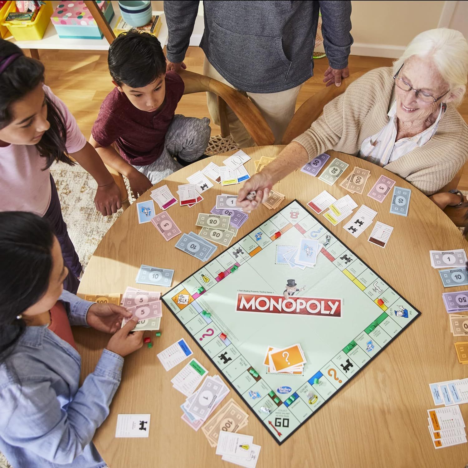 Demonstrates the product being enjoyed in a real-world family setting, showing its appeal across different age groups and its role in bringing people together for quality time.