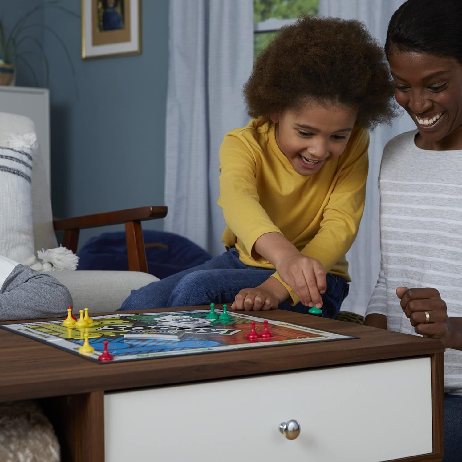 Demonstrates the product being enjoyed in a real-world home setting to help shoppers visualize the product as part of family time and everyday life.