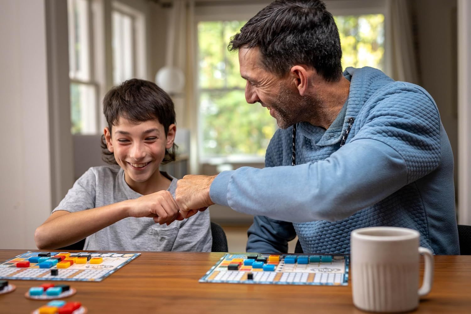 Demonstrates the product being enjoyed in a real-world home setting to create emotional connection and show the product brings families together for quality time.