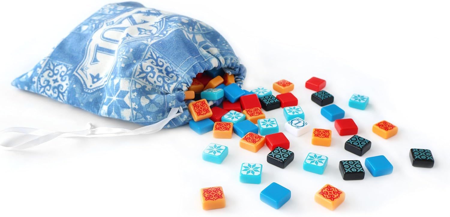 Shows the customer everything included in the purchase: the decorative storage bag and all the colorful game pieces, demonstrating the completeness and value of the set.