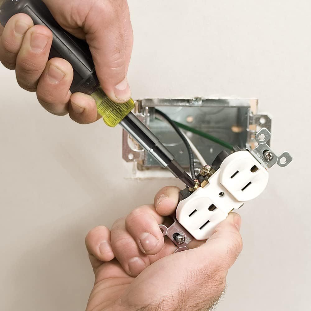 Demonstrates how to use the product (voltage tester or screwdriver) during electrical outlet installation, reassuring shoppers about its practical application and ease of use. Shows the product in a…