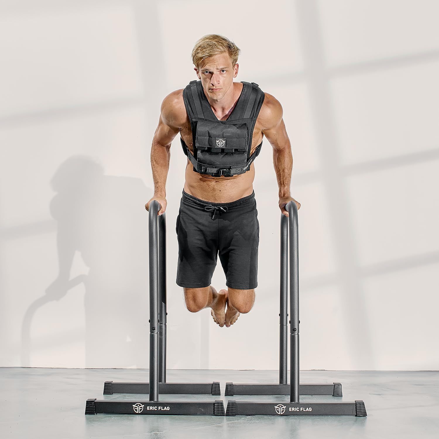 Demonstrates the product in use during an intense workout scenario, showing the weighted vest being worn during a challenging exercise to help shoppers visualize real-world application.