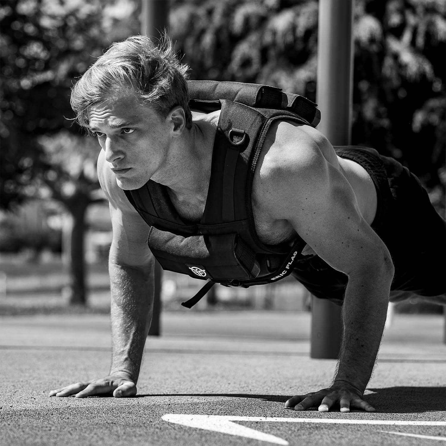 Demonstrates the product being used in a real-world outdoor fitness context to help shoppers visualize themselves using the weighted vest during exercise.