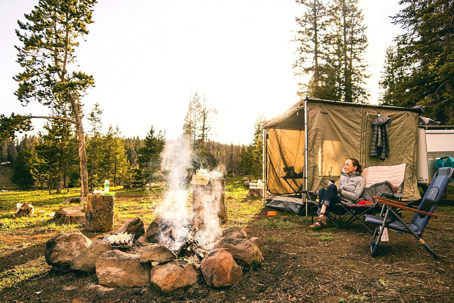 Demonstrates the product in a real-world outdoor camping setting to help shoppers visualize using it in nature, creating an aspirational and authentic connection to the camping lifestyle.
