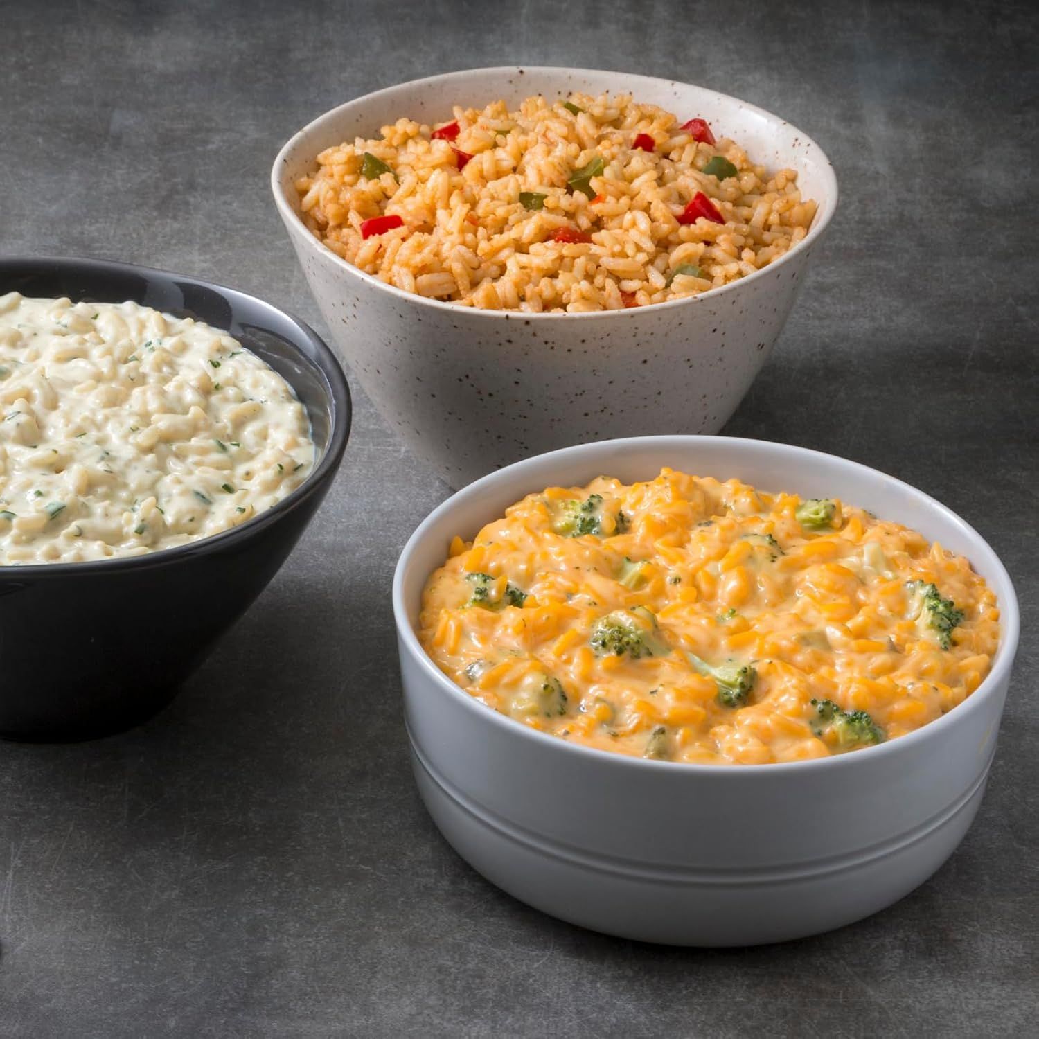 Displays the brand's product portfolio by showing three different prepared rice/pasta side dish options, helping shoppers understand the variety available and choose between different flavors or…