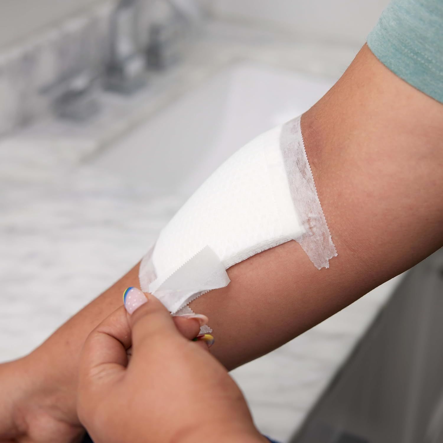 Demonstrates how to apply the product (likely a wipe or cleansing cloth) to the skin, showing shoppers the proper usage technique.