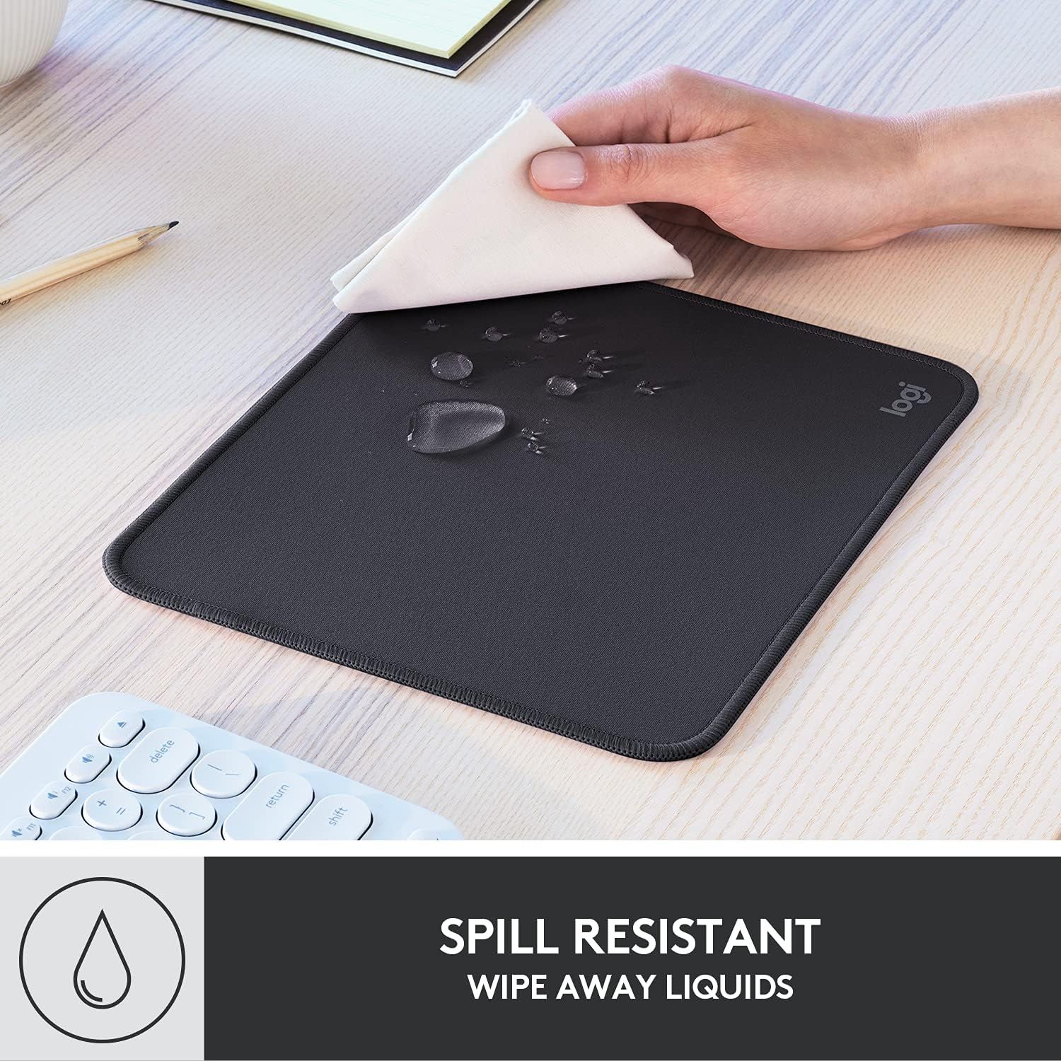Demonstrates the mouse pad's waterproof and spill-resistant properties, reassuring shoppers that liquids can be easily wiped away without damage.