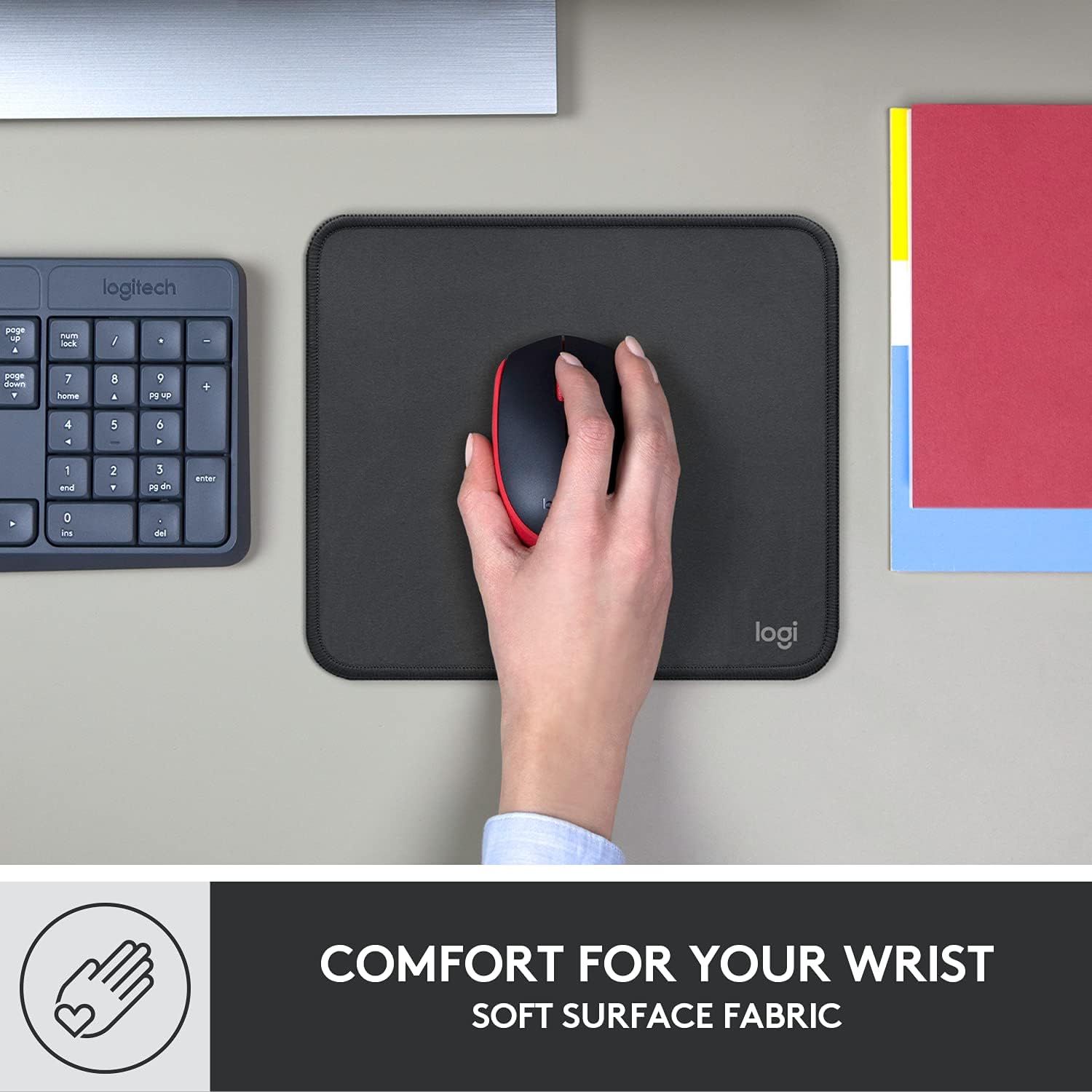 Communicates that the mouse pad provides ergonomic wrist comfort through its soft fabric surface, reassuring shoppers about comfort during extended use.
