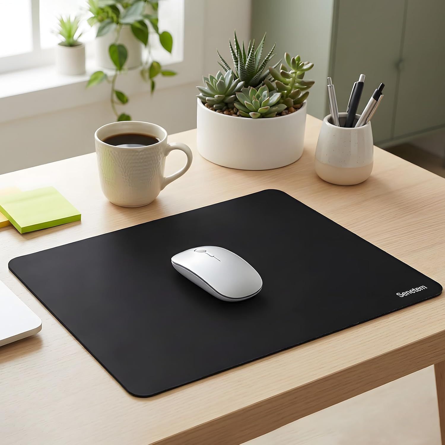Demonstrates the product in a real-world office environment to help shoppers visualize how the mouse pad fits naturally into their workspace aesthetic.