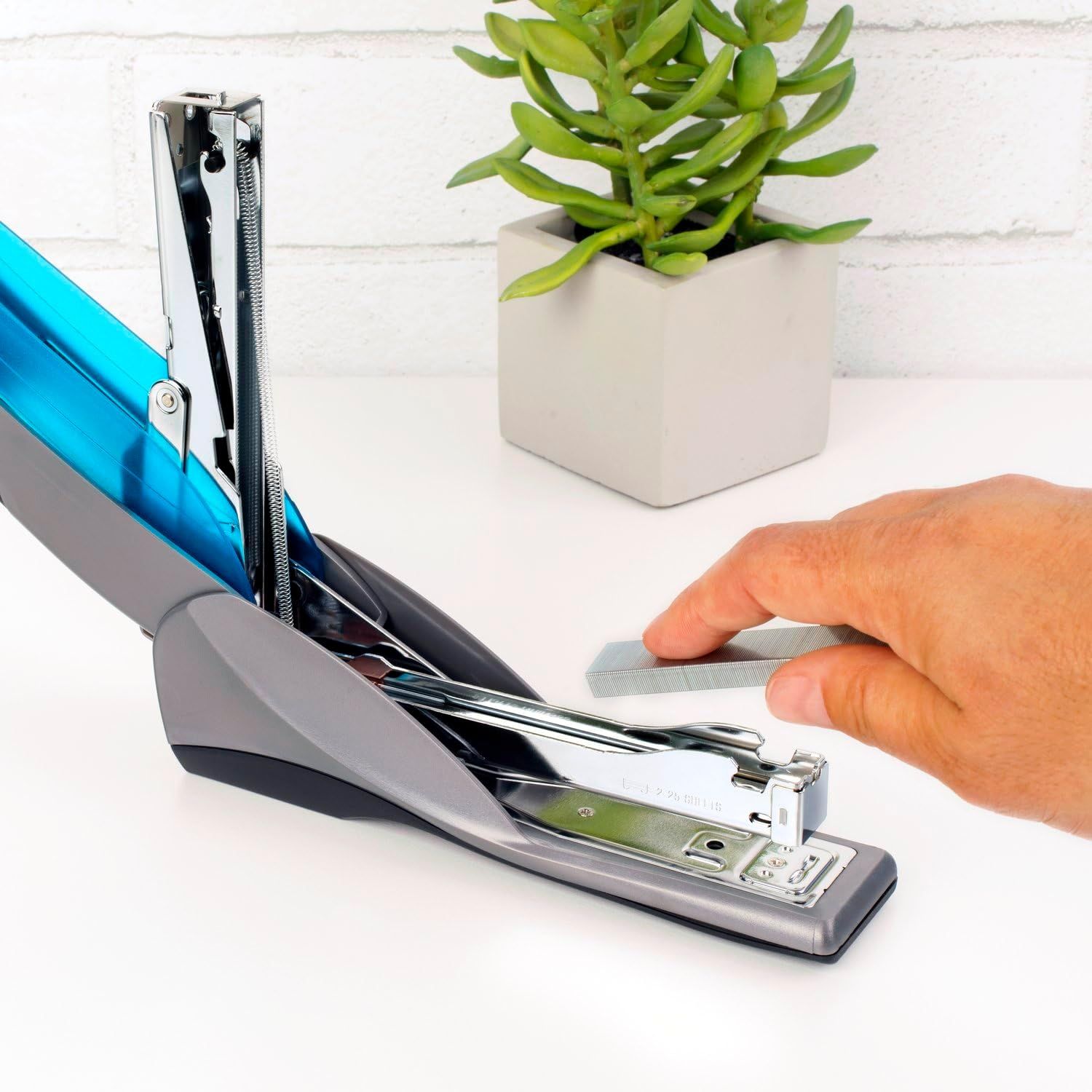 Demonstrates how to use the stapler's built-in staple remover feature, showing shoppers the simple one-hand operation for removing staples. Highlights the convenience of having an integrated staple…