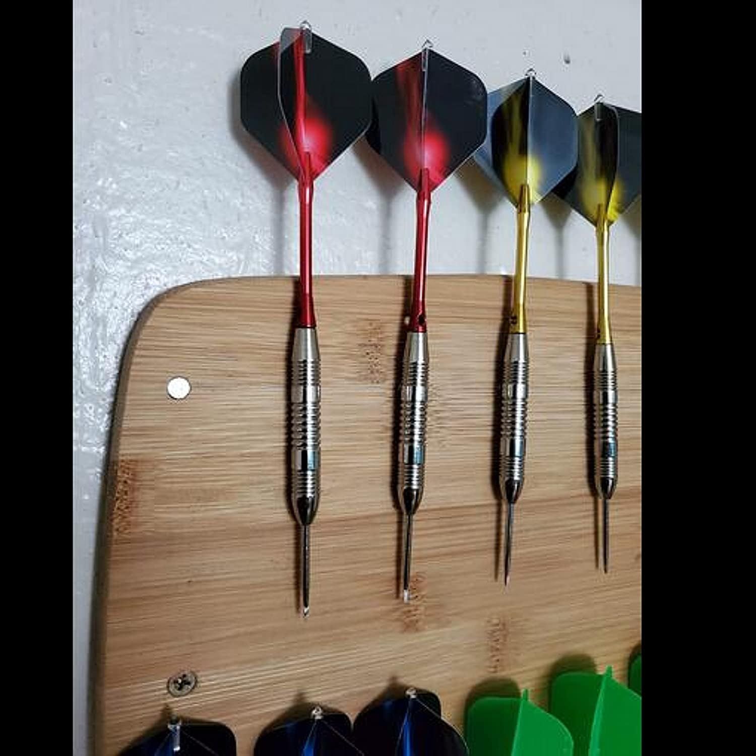 Showcases the brand's product lineup by displaying multiple dart color options available to shoppers, helping them understand the variety and choose their preferred style.