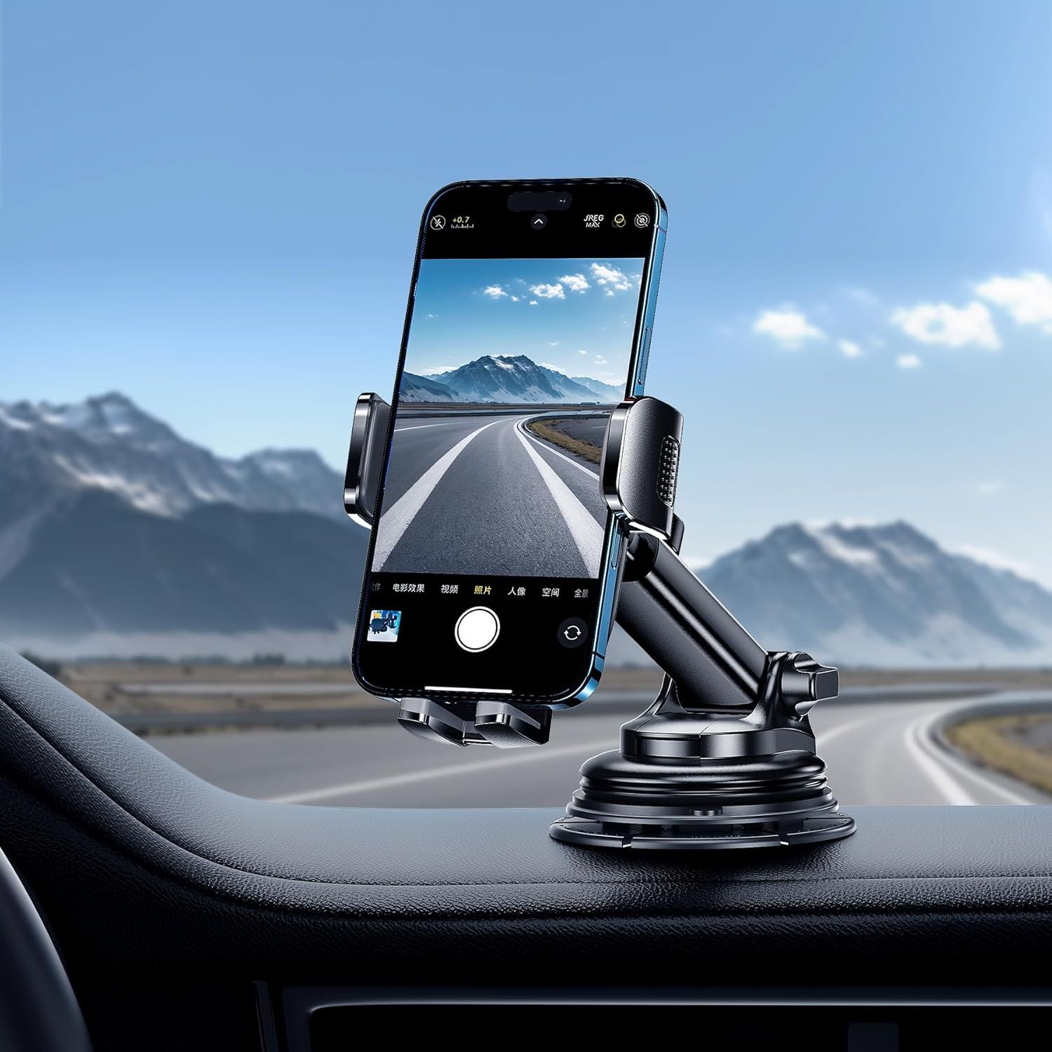 Demonstrates the product in a real-world driving scenario, showing how the phone mount securely holds a device on the dashboard for navigation or hands-free use during travel.