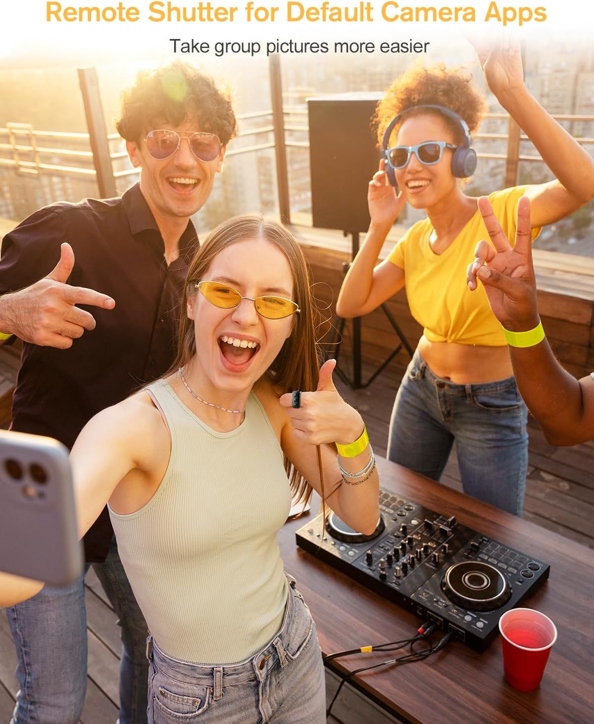 Demonstrates how the remote shutter feature makes it easier to take group pictures by allowing everyone to be in the photo without needing someone to hold the camera.