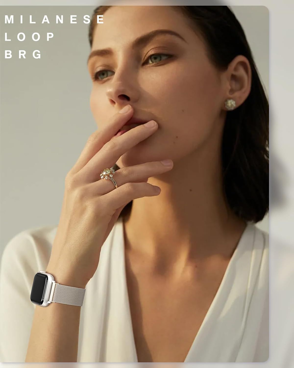 Showcases the jewelry products (ring, earrings, watch band) in an aspirational lifestyle context to help shoppers visualize how the pieces look when worn in a sophisticated, real-world setting.