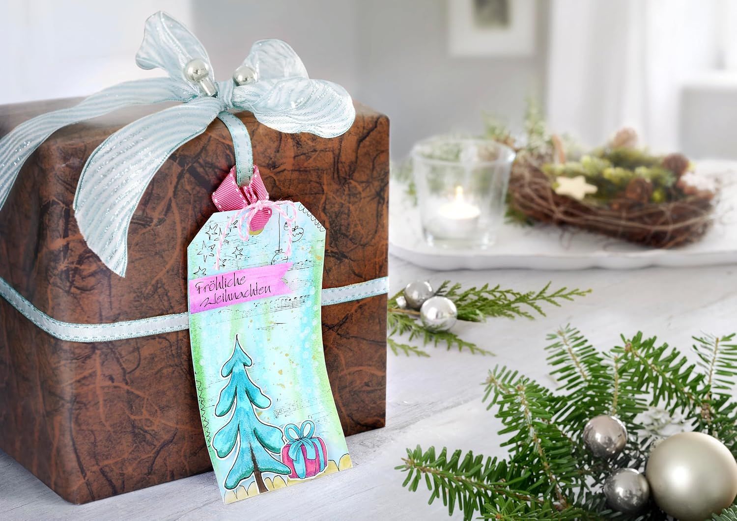 Positions the product as a perfect holiday gift option, emphasizing its seasonal appeal and gift-worthiness through festive wrapping, ribbon, decorative tag, and Christmas decorations.