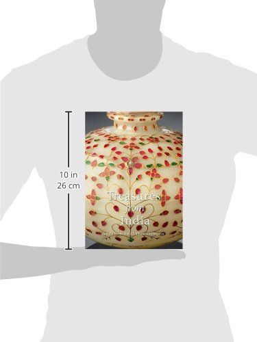 Demonstrates the physical size of the book by showing it held against a person's torso with a measurement scale indicating it is 10 inches (26 cm) tall.