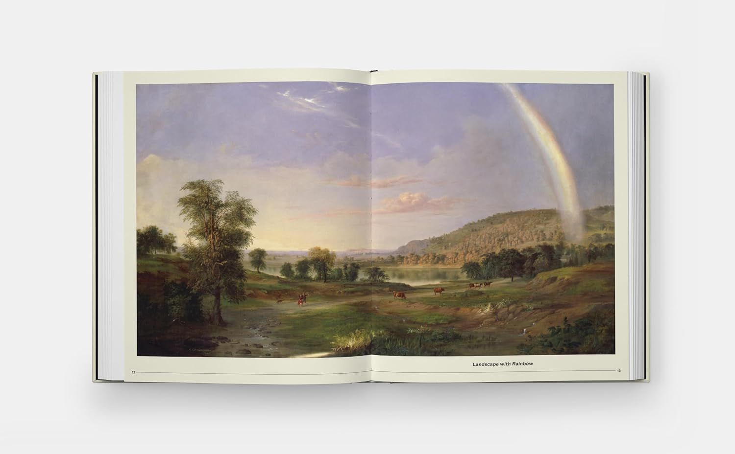 Displays the product (art book or print) in a real-world context to help shoppers visualize the quality and aesthetic of the artwork without any text overlay or feature callouts.