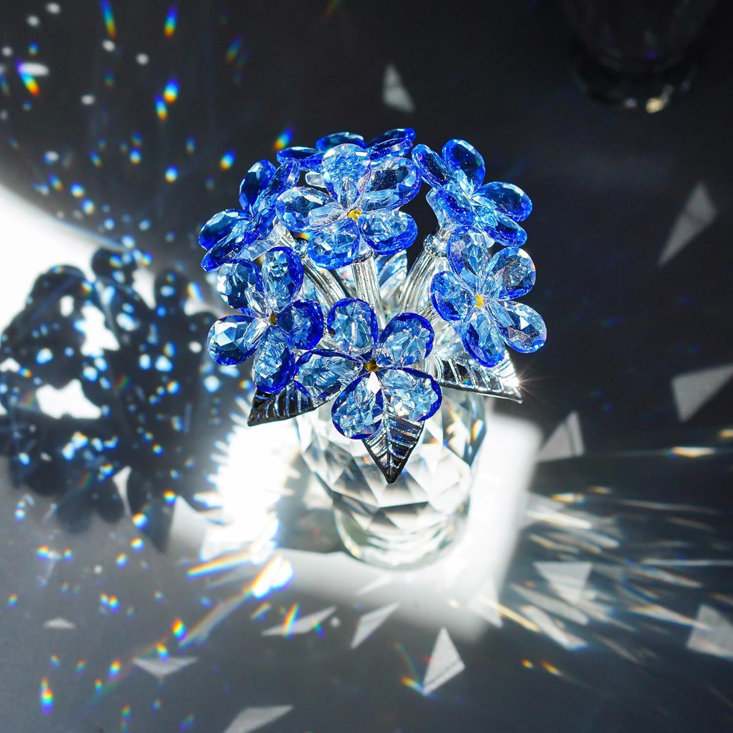 Showcases the decorative crystal flower product in an elegant, artistic setting with dramatic lighting to emphasize its beauty and premium quality as a display piece.