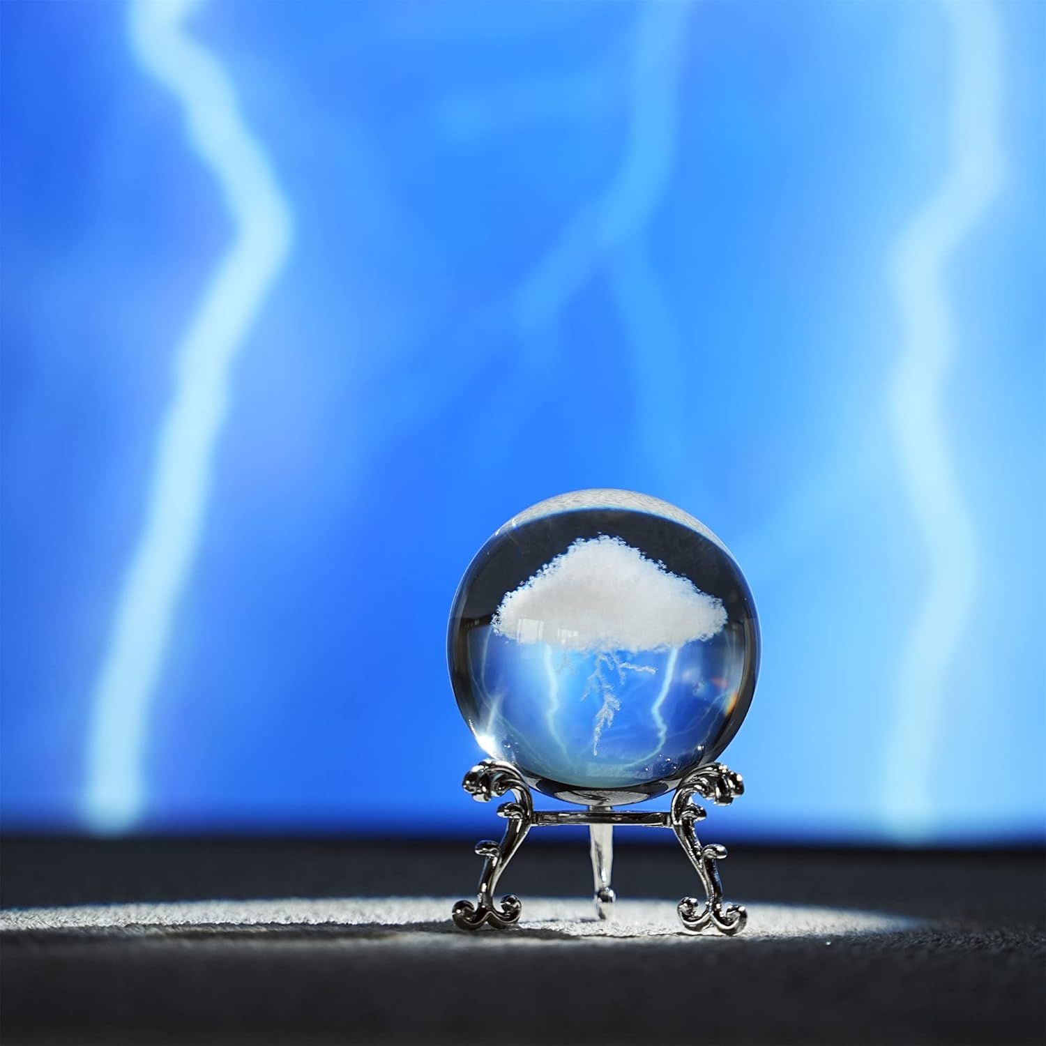 Creates an artistic, atmospheric lifestyle scene showing the product (crystal ball) in a visually striking real-world setting to evoke emotion and aesthetic appeal.