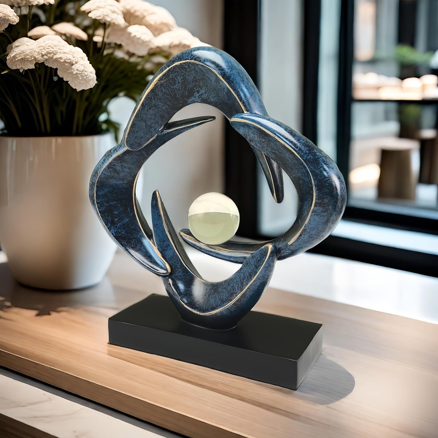 Showcases the decorative sculpture in a real-world home setting to help shoppers visualize how the product would look displayed in their own living space.