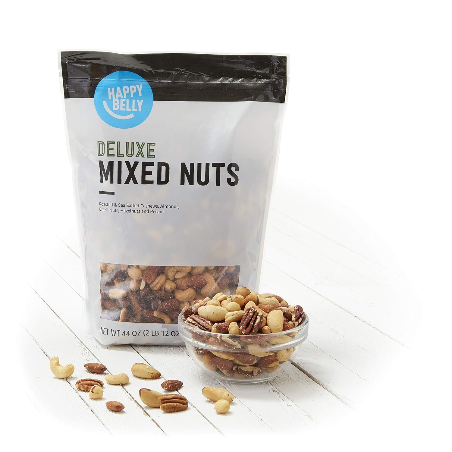 Shows the customer exactly what they receive in the package—a variety of deluxe mixed nuts including cashews, almonds, brazil nuts, hazelnuts, and pecans—to communicate value and transparency.
