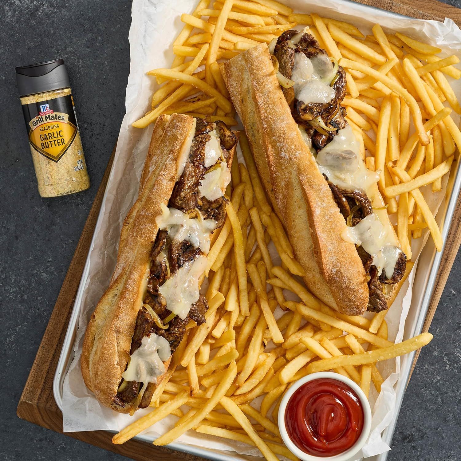 Showcases the product (cheesesteaks and fries) in an appetizing, real-world serving context to help shoppers visualize the meal experience and appeal to their appetite.