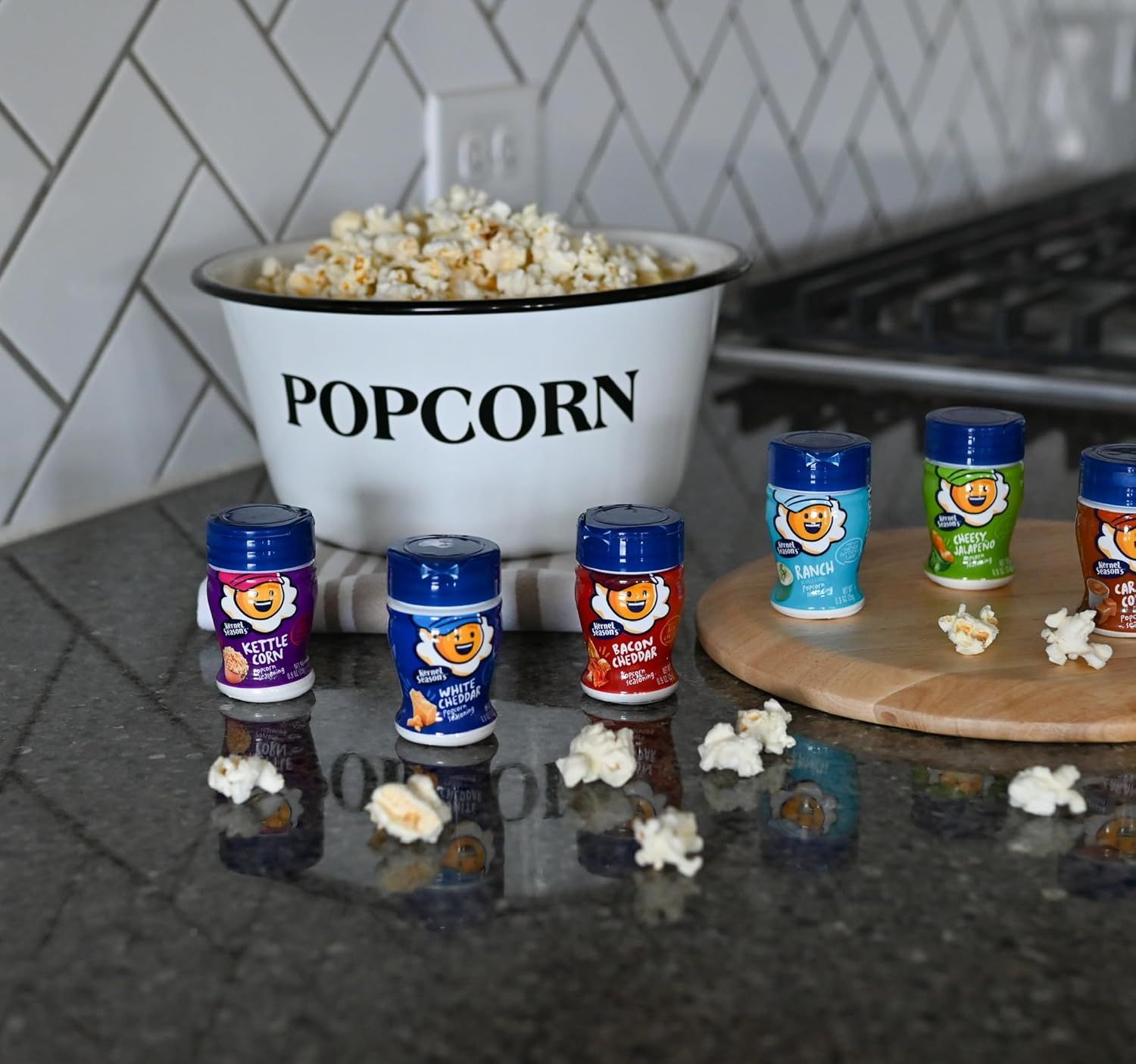 Displays the brand's full product lineup of popcorn seasonings in multiple flavors to help shoppers understand the variety available and choose their preferred option.