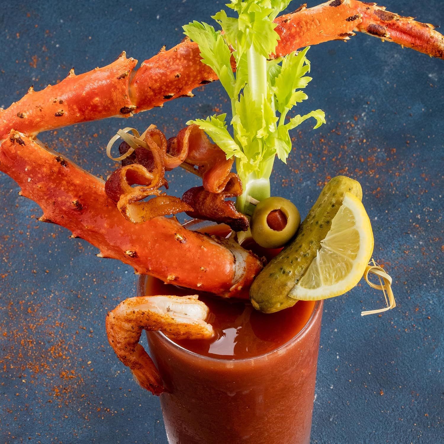 Showcases the product in an upscale, appetizing real-world context to convey quality and appeal to shoppers looking for premium cocktail or food ingredients.