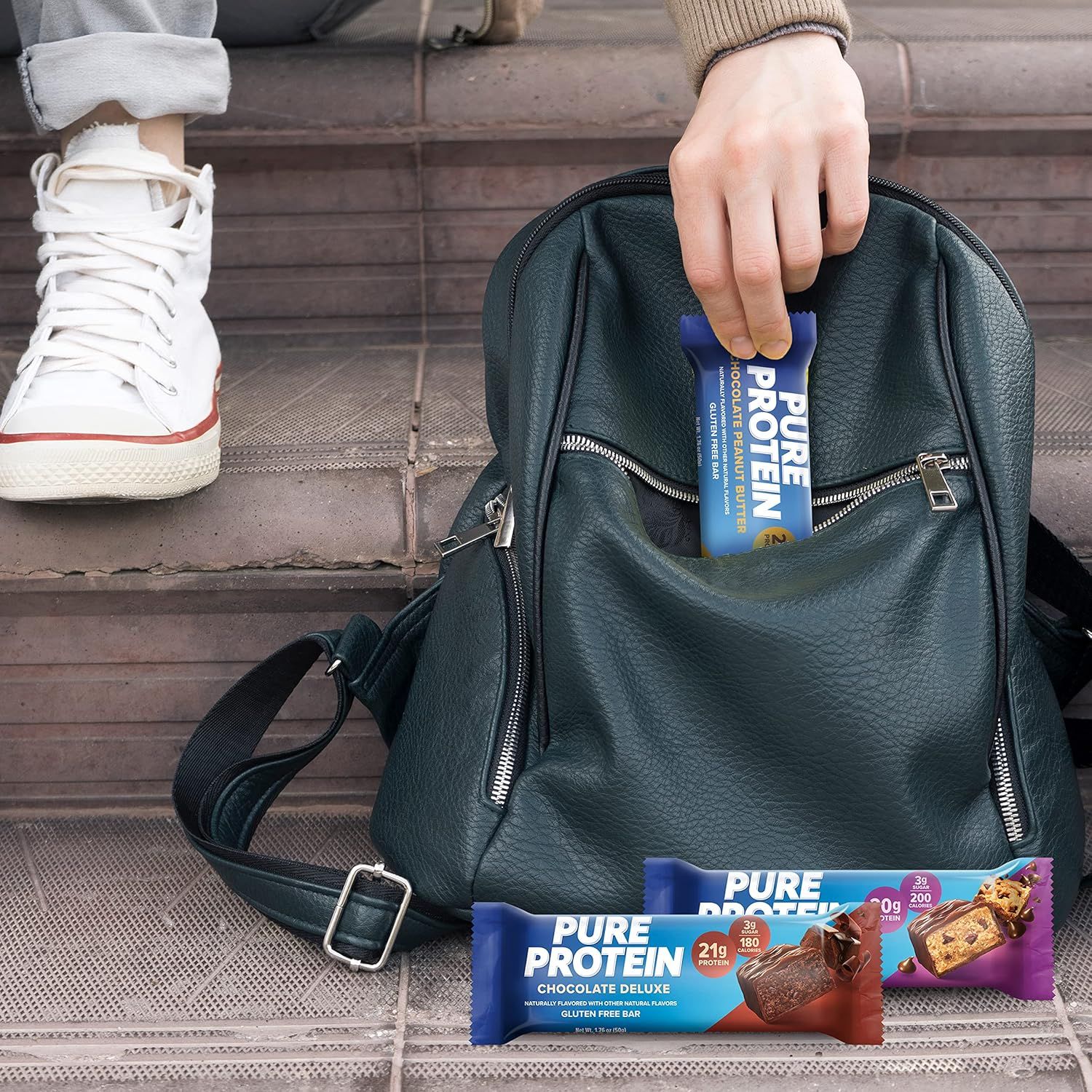 Demonstrates the product's portability and convenience for active lifestyles by showing protein bars fitting easily into an everyday bag.