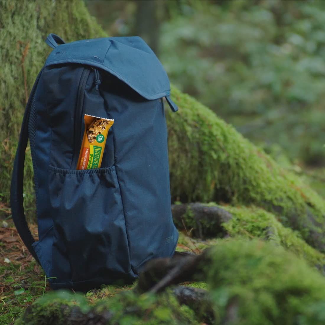 Demonstrates the backpack in a real-world outdoor setting to help shoppers visualize using it for hiking, camping, or nature activities.
