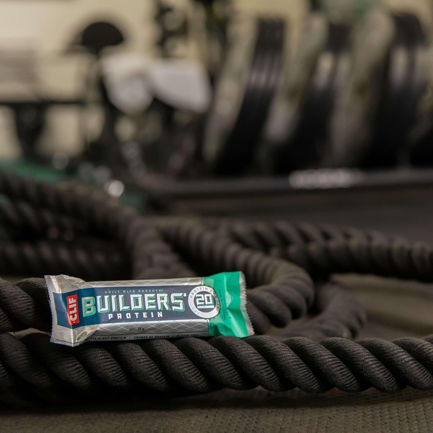 Positions the protein bar as part of an active fitness lifestyle by showing it in a gym setting with workout equipment, appealing to fitness-conscious consumers.