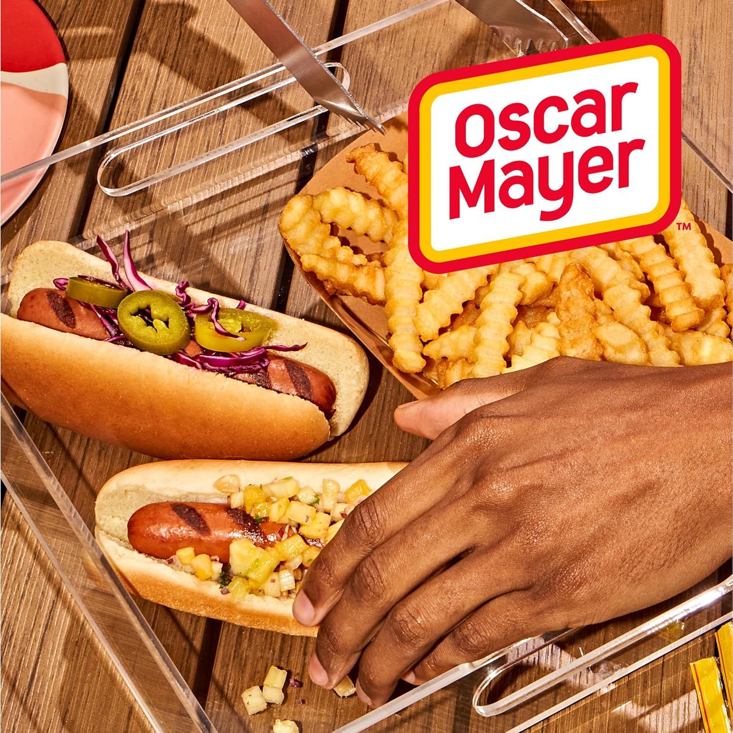 This image showcases the Oscar Mayer brand prominently in a lifestyle setting, reinforcing brand recognition and associating the brand with enjoyable outdoor dining experiences.