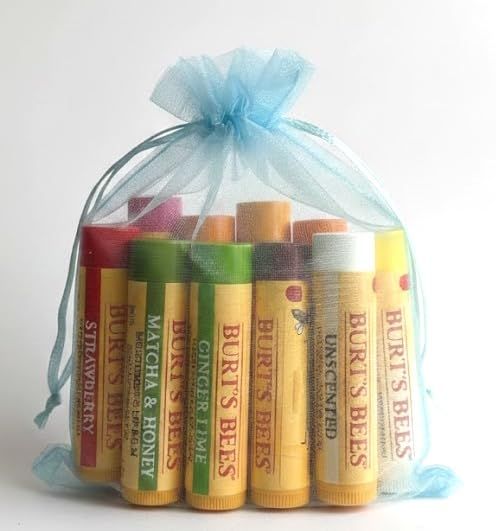 Positions the product as a ready-to-give gift by showing multiple lip balms bundled in a decorative organza bag, appealing to shoppers looking for gifting options.