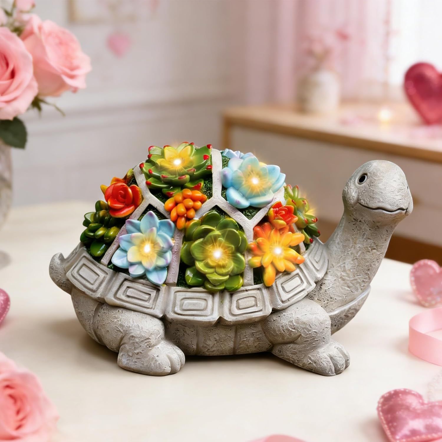Showcases the decorative turtle figurine with illuminated succulents in a styled home environment to help shoppers visualize how the product looks in a real-world setting.