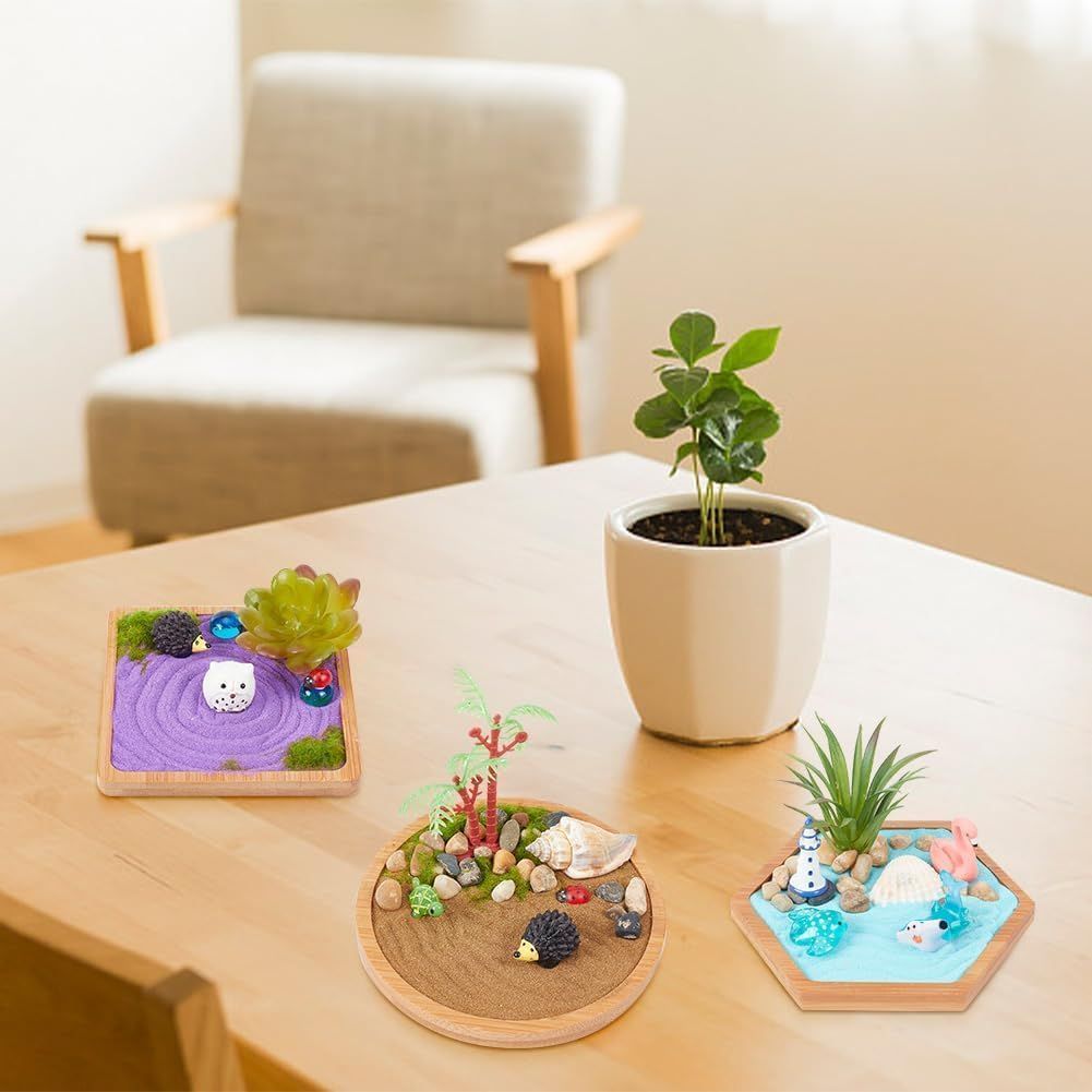 Shows the product in a real-world home setting to help shoppers visualize how these decorative miniature garden kits would look on their own table or shelf.