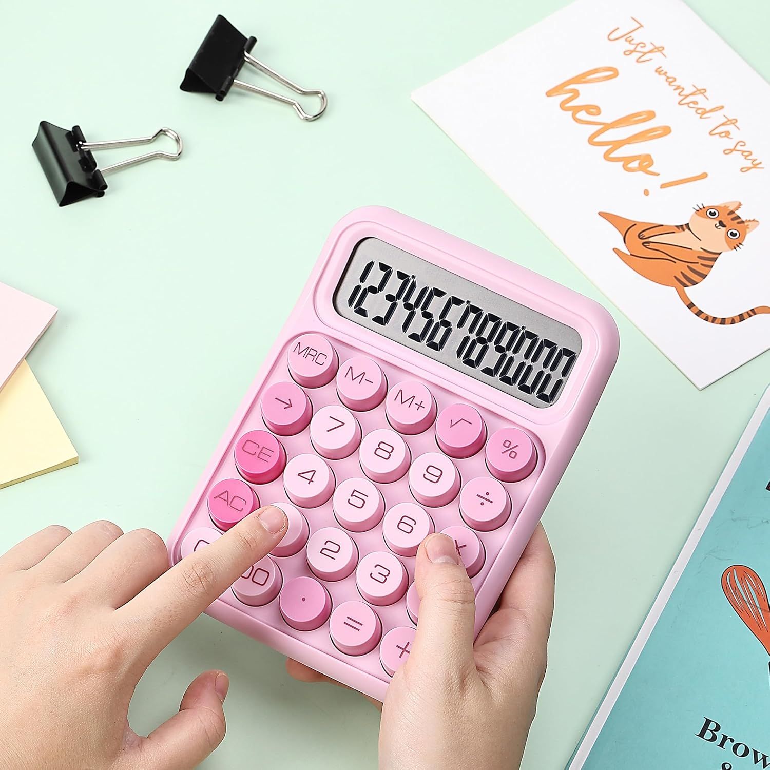 Shows the calculator in a real-world office or study environment to help shoppers visualize the product in their own workspace.
