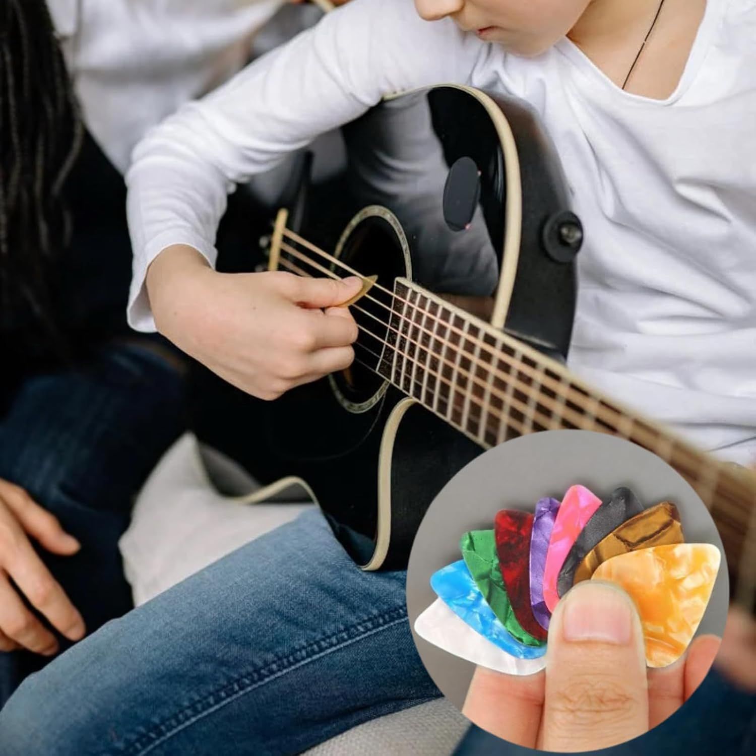 Shows the customer that colorful guitar picks are included with the guitar purchase, adding value and demonstrating the product is ready to use out of the box.