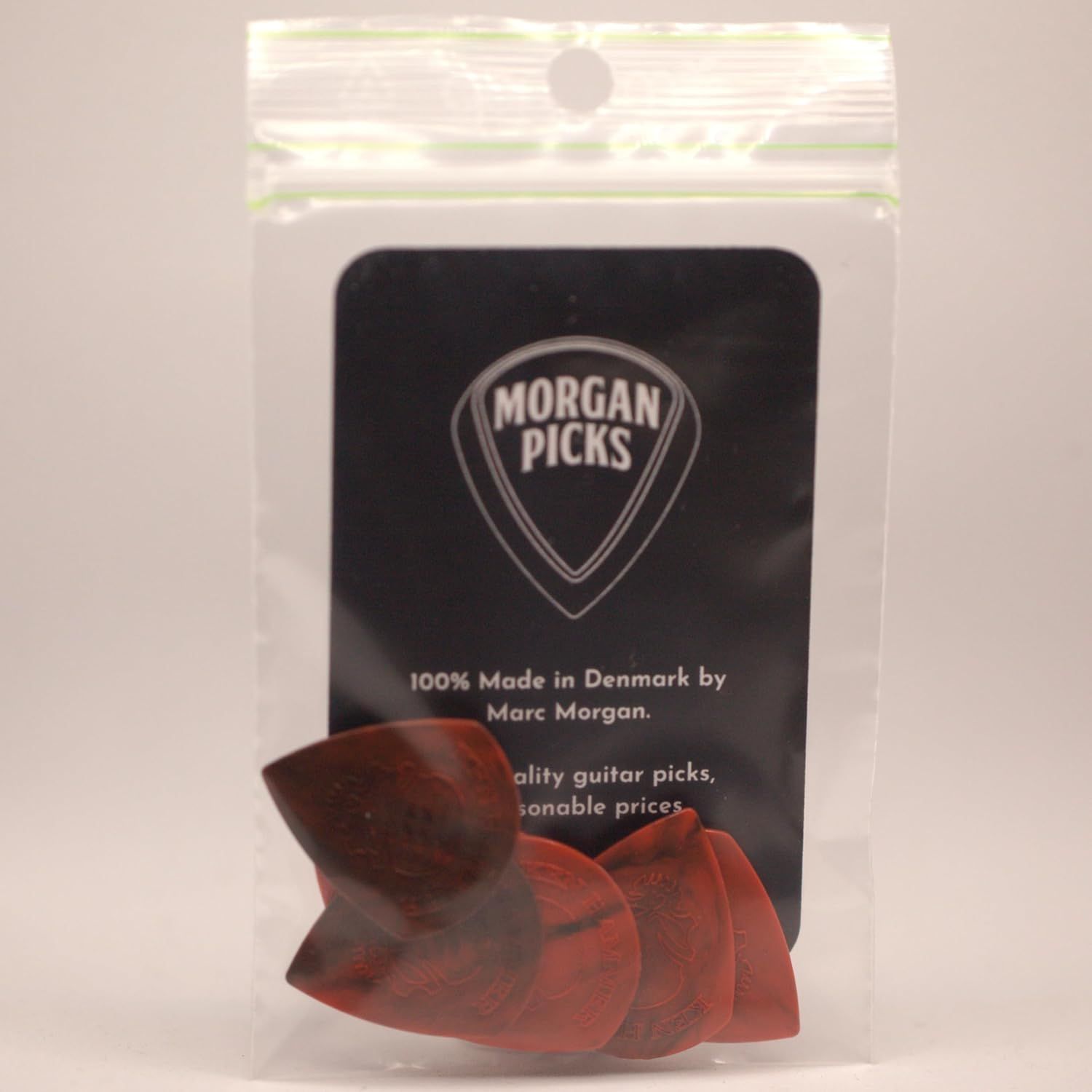 Communicates the brand identity and heritage of Morgan Picks, emphasizing Danish craftsmanship and positioning the product as quality guitar picks at reasonable prices.