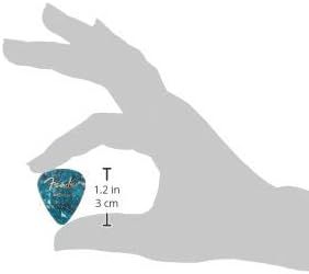 Demonstrates the actual physical size of the guitar pick by showing it held in a hand with measurement arrows indicating it is 1.2 inches (3 cm), helping shoppers understand the product's compact…