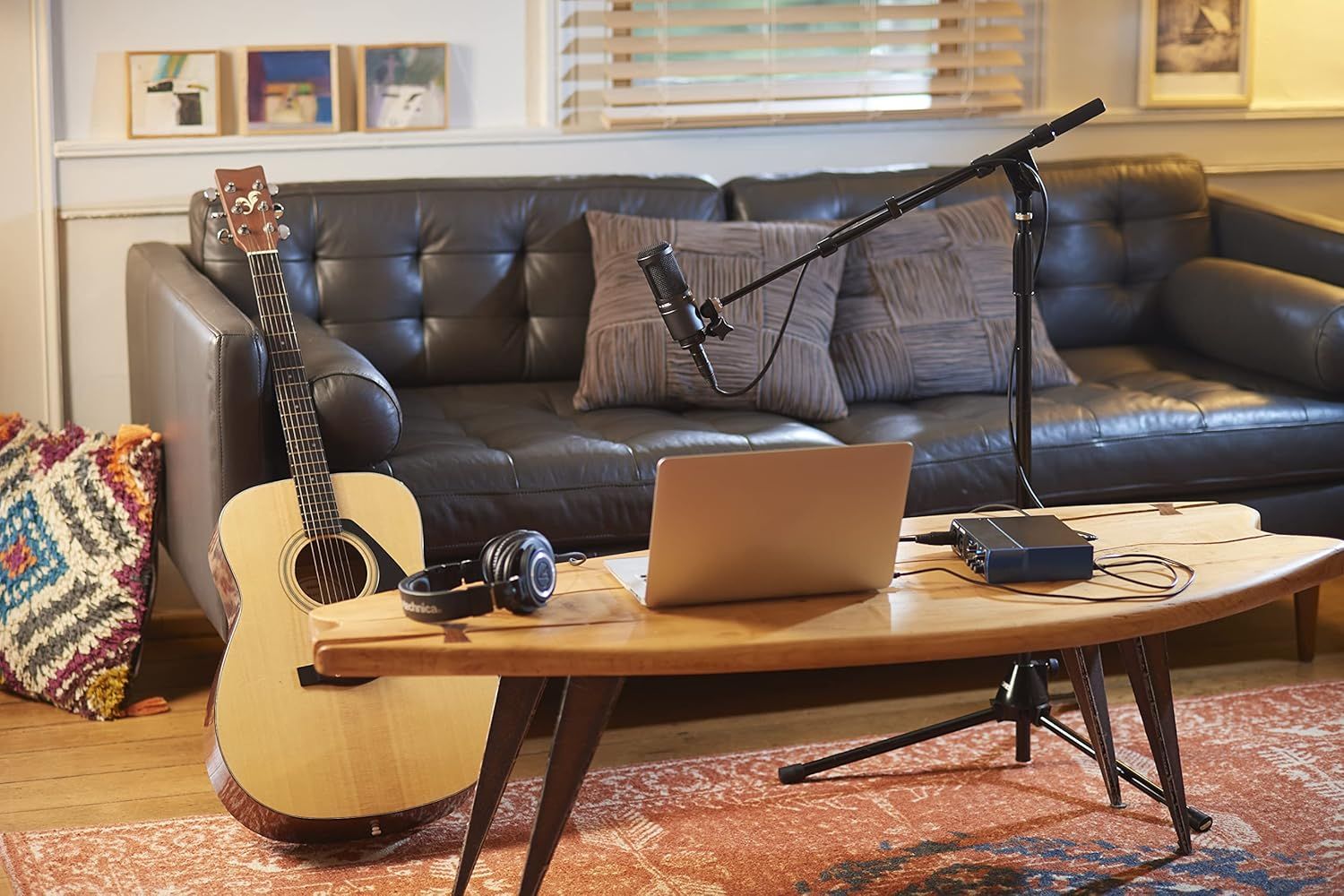 Demonstrates the product in a real-world home studio context, showing how it fits naturally into a musician's creative workspace for recording and content creation.