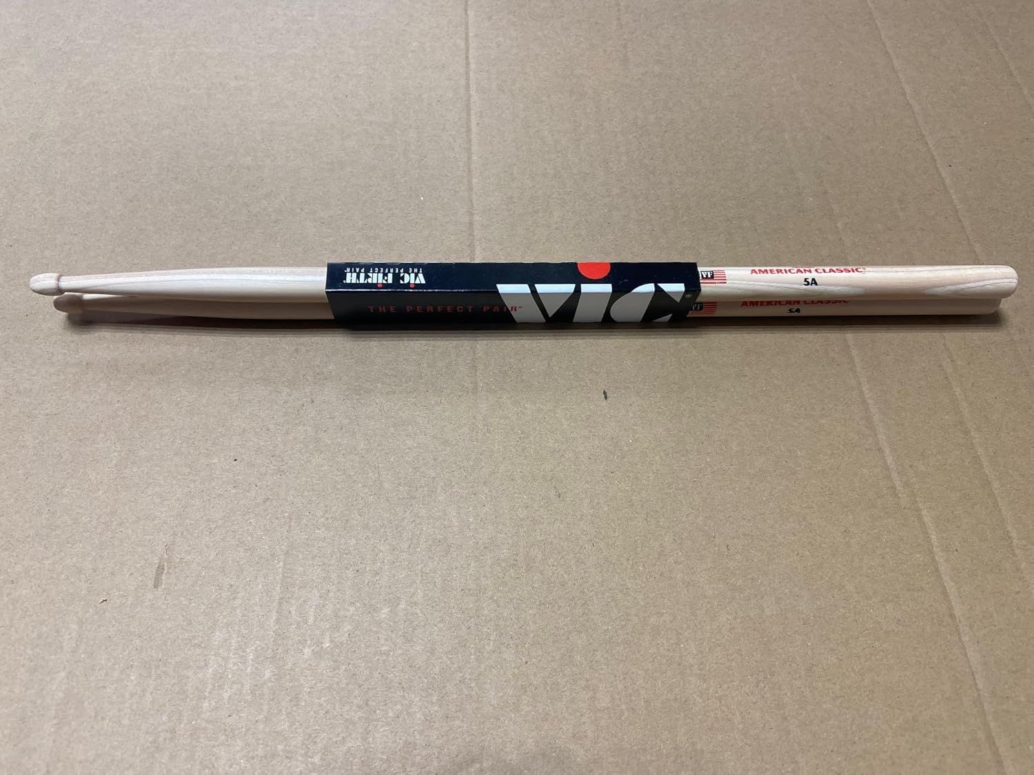 Shows the product in its retail packaging to help shoppers understand what they will receive when purchasing, including the pair of drumsticks and brand packaging.